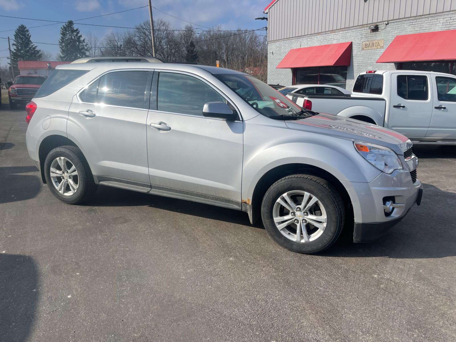 2013 Silver /Black Chevrolet Equinox 2LT 2WD (2GNALPEK5D6) with an 2.4L I4 DOHC 16V engine, 6-Speed Automatic transmission, located at 11115 Chardon Rd. , Chardon, OH, 44024, (440) 214-9705, 41.580246, -81.241943 - This 2013 Chevrolet Equinox 2LT FWD with the 2.4L EcoTec engine pairs fuel efficiency with comfort and technology. It comes equipped with a 6-speed automatic transmission assuring smooth transitions and features heated seats for added comfort during colder months. The automatic climate control syste - Photo #3